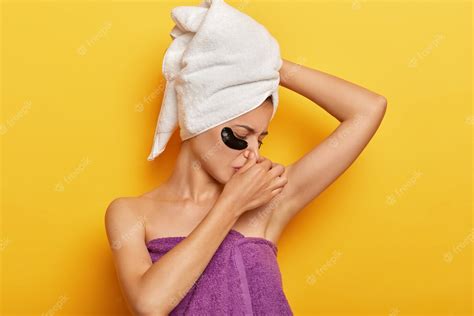 Free Photo Displeased Young Lady Smells Sweaty Armpit Covers Nose