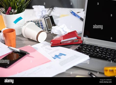Messy And Cluttered Office Desk Stock Photo Alamy