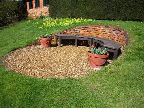 How to build a fire pit on a budget. sheltered seating area on a slope | Geneigter hinterhof ...