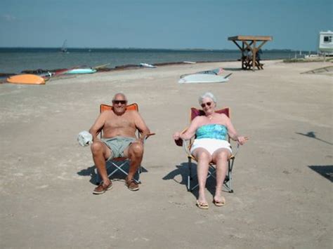 Grandpa And Grandma Relaxing On The Beach Beach Grandma Grandpa