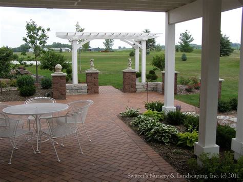 Materials used to build pergolas vary between wood. Backyard Pergolas & Patios | Patio pavers design, Pergola ...