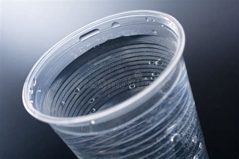 Macro Of A Plastic Cup Filled Up With Nearly 200ml Water Stock Photo