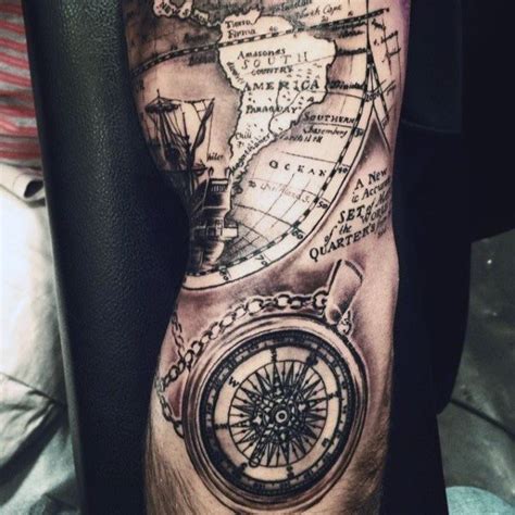 a man s arm with a map and compass tattoo on it in black and grey
