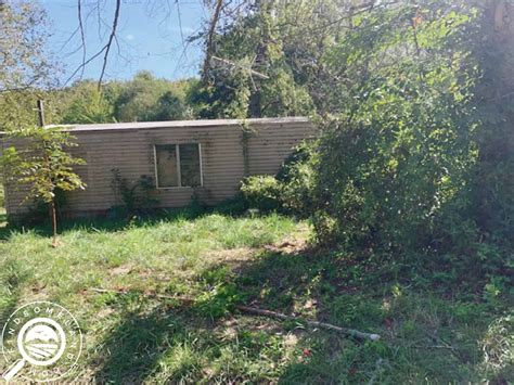 0.3 Acre Lot With a Mobile Home For Sale Next To Yellow Banks Lake