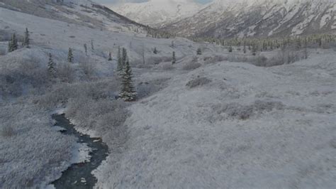 4k Stock Footage Aerial Video The Moon Over The Snow Covered Chugach