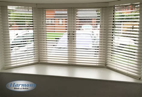 Maybe you would like to learn more about one of these? White Wooden Blinds in a Bay Window - Harmony Blinds ...