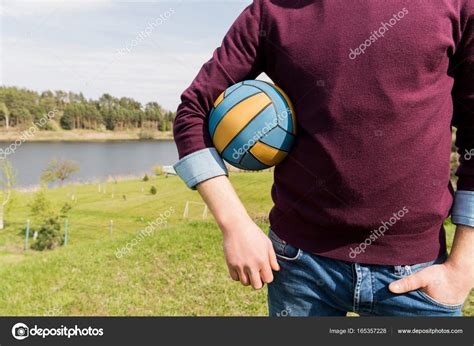 Man Holding Ball — Stock Photo © Igorvetushko 165357228