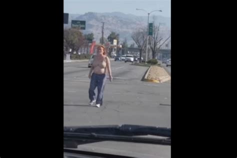 Watch This Woman Take Her Bra Off In The Middle Of A Busy Intersection Nsfw Video