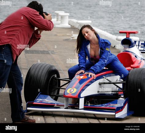 Racing Cars And Sex A Model Poses For Photographers On The Bonnet Of A Formula One Racing Car