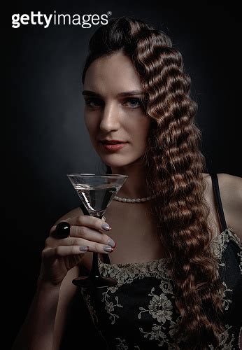 Portrait Of A Beautiful Woman With Glass Of Martini