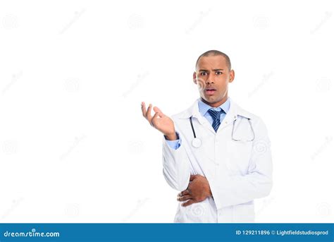 Shocked African American Male Doctor In White Coat With Stethoscope