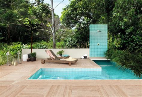 Pictures of outdoor patio tile designs using pavers, marble, slate, rubber or wood decking. Impressive Pool Deck Tiles Contemporary with Lighting ...