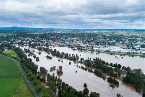Image Of Looking Across Flooding Hunter River Towards The Levee Bank