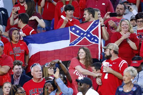 Flag, a piece of cloth, bunting, or similar material displaying the insignia of a sovereign state, a community, an organization, an armed force, an office, or an individual. Black Mississippi Mayor Tears Up As He Signs Order To ...