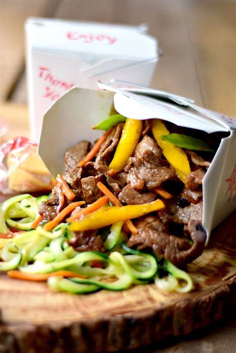 The mandoline creates the best flat pros: Beef Zoodle Stir Fry spilling out of a take-out container ...
