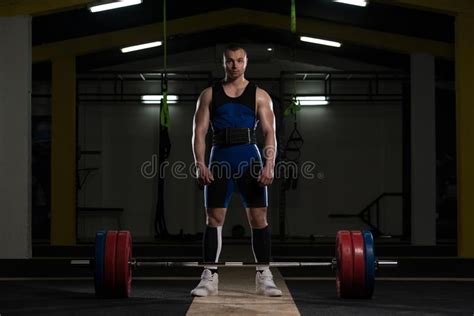 Athlete Of Powerlifter Attempt Deadlift A Heavy Barbell Stock Photo