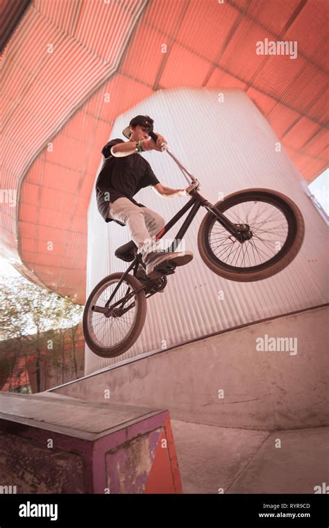 Bmx Rider Makes A Tailwhip Trick Young Man Doing Tricks In The Air On