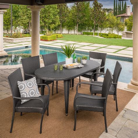 Sola Outdoor 7 Piece Wicker Oval Dining Set With Stacking Chairs Grey