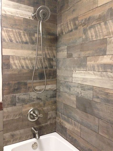 The result is that there are many different types of tubs you can choose from for your bathroom. Rustic bathroom. Wood tile tub, shower surround. #marazzi ...