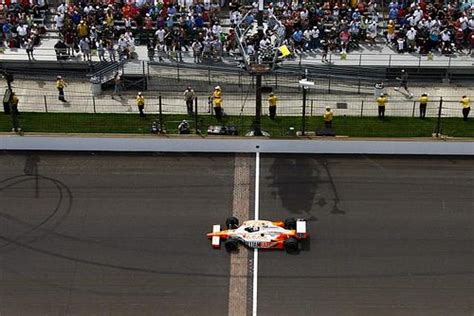 Dan Wheldon Savings Strategy Indy 500 First Drive Checkered Flag