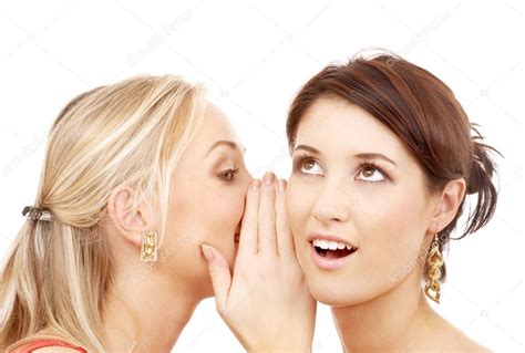 Two Smiling Women Whispering Gossip Stock Photo By ©sydaproductions