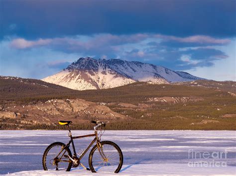 Bike On Frozen Lake Laberge Yukon Canada Photograph By Stephan Pietzko