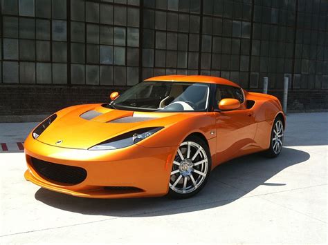 By pairing the burnt orange wall color with a shade that shares the same undertone, the room's look has cohesive. Lotus Evora in orange. This color looks swag. | Lotus, Lotus car, Orange