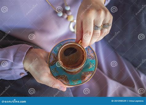 Muslim Woman S Hands Holding A Cup Of Traditional Turkish Coffee Stock