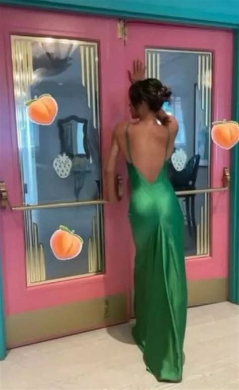 Victoria Beckham Dons Backless Silk Dress As She Shows Off Cheeky Side
