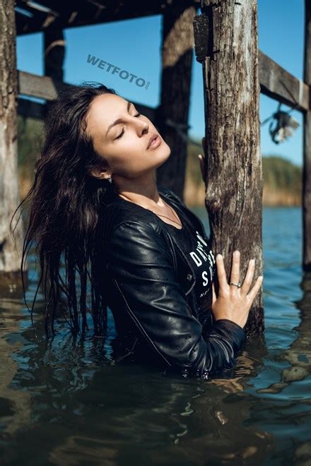 Fully Dressed Brunette Walks On Water And Gets Completely Wet Wetfoto