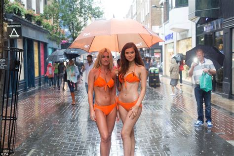 Tanorganic Models Wearing Skimpy Orange Bikinis Get Drenched In London Rain Daily Mail Online