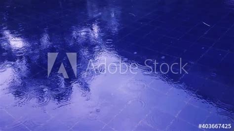 Stock Footage Of Natural View Rain Drop With Ripple Wave On Blue Water Surface In The Rain Of