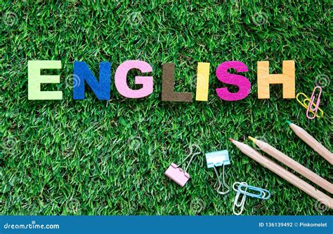 Colorful English Word Cube On Green Grass Yard Background English