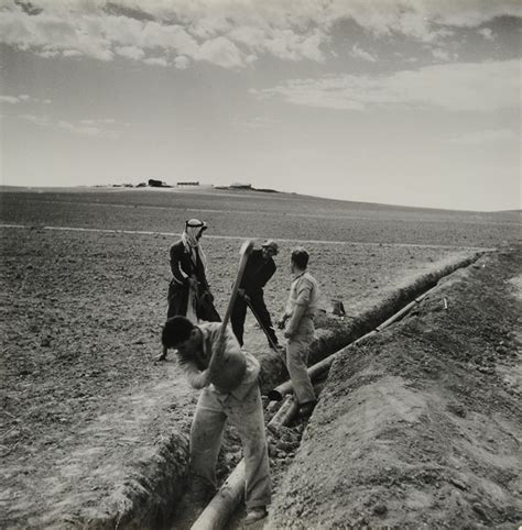 Workers Laying A Water Pipe In The Negev Desert Land Of Israel The