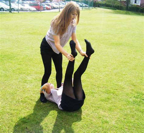 Girls In Schoolgirl Uniform And Black Opaque Pantyhose Playing On The Fieldwoman In Pantyhose