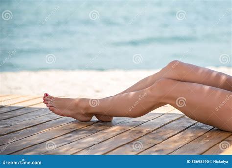 Woman S Beautiful Legs On The Beach Stock Photo Image Of Pleasure Blue
