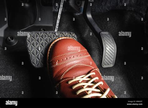 Foot Pressing The Brake Pedal Of A Car Stock Photo Alamy