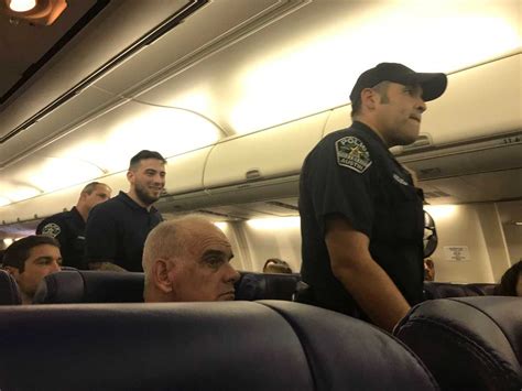 Austin Plane Passenger Allegedly Held Man In Headlock Threatened To Kill Officer