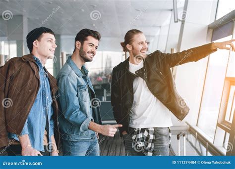Happy Friends Flourishing Hands In Hall Stock Photo Image Of Excited