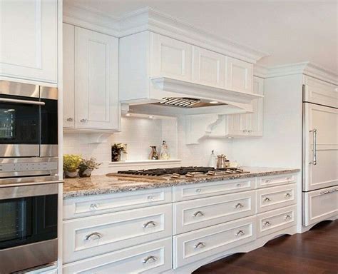 When most homeowners go for monochromatic in the kitchen, they'll opt for a timeless bright white. Hood design Benjamin Moore | Oxford White Cabinets ...