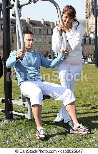 Couple Doing Gymnastics Outdoors