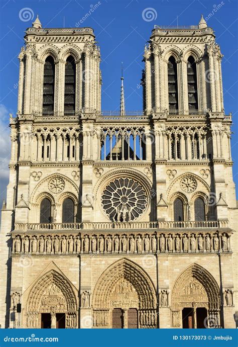 Notre Dame Cathedral. Paris, France. Gothic Facade with Sun Light