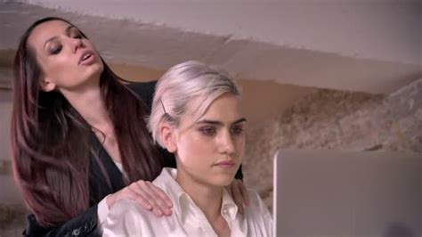 Two Young Pretty Lesbians Working In Modern Office Woman Flirting With
