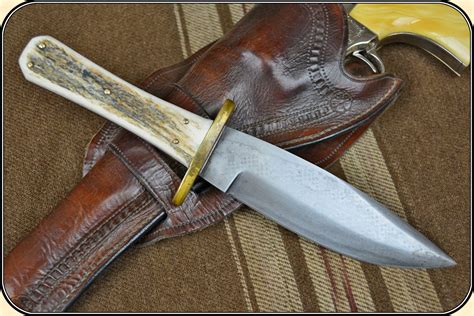 The handle is gorgeous red stag accented with black spacers and s.s. Custom made Stage Handled Bowie
