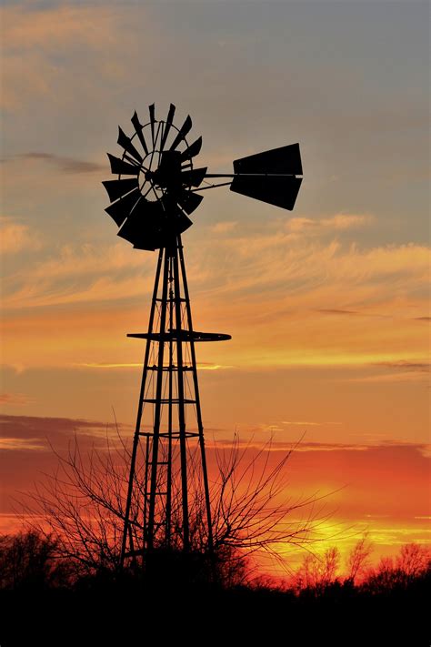 Kansas Golden Sunset With A Windmill Silhouette Out In The Country