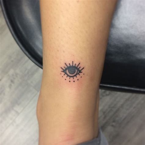 15 Tiny Evil Eye Tattoo Ideas To Ward Off Misfortune