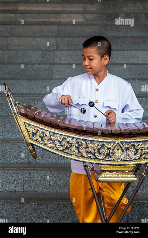 Unidentified Boy Playing Xylophone On The Street Of Bangkok Thailand