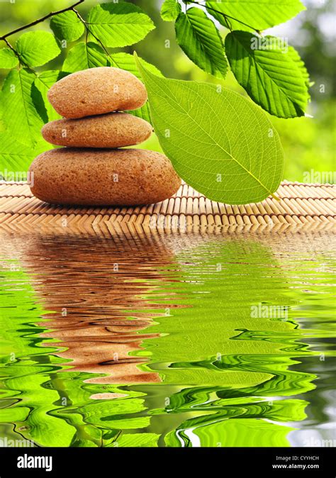 Zen Stones And Water Reflection Showing Spa Concept Stock Photo Alamy