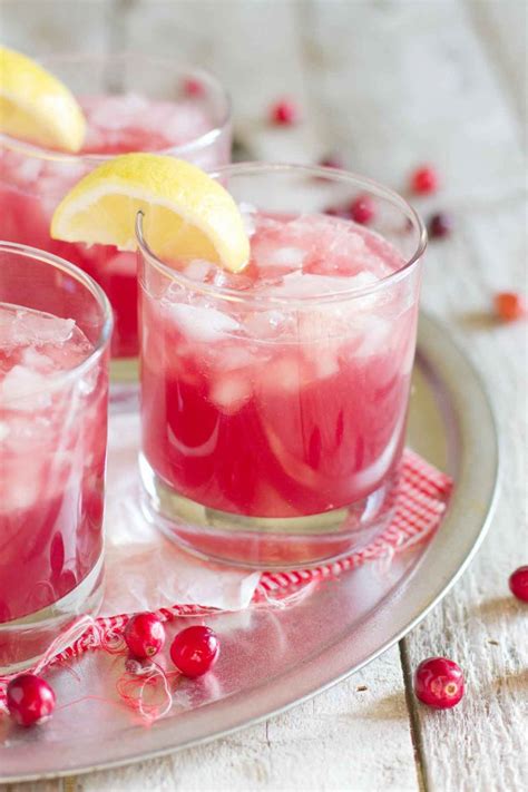 Two Glasses Filled With Cranberry Lemonade On Top Of A Silver Platter