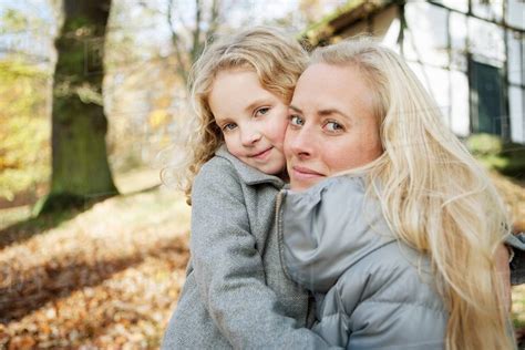 Mother And Daughter Hugging Outdoors Stock Photo Dissolve